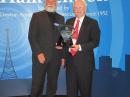 ARRL CEO David Sumner, K1ZZ, receives Hamvention's Special Achievement Award from DARA Treasurer Michael Kalter, W8CI. [Becky Schoenfeld, W1BXY, photo]